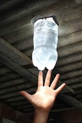 Liter of light: a bottle, refilled with water and a little bleach, brings sunlight into a room in a shanty town.